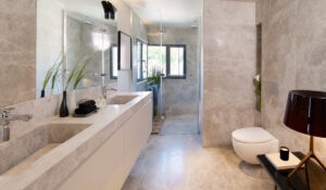 Modern bathroom with furniture in matte beige texture
