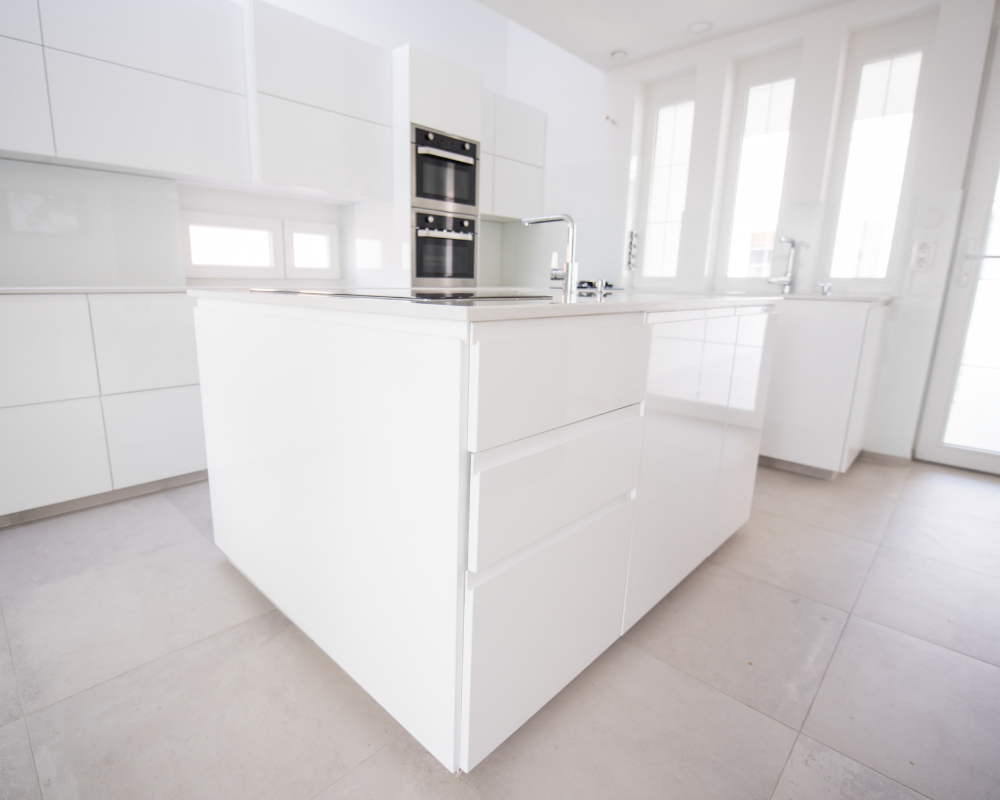 White kitchen cabinets with square island